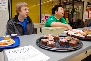 HEALTHY DIET: Sophomores Ross DeJohn (left) and Austin Wang sell cupcakes for FCCLA at the main cafeteria on Mar. 5. They must measure the calories in the cupcakes and make sure less than 30 percent comes from fat. ARJUNA CAPULONG / PHOTO