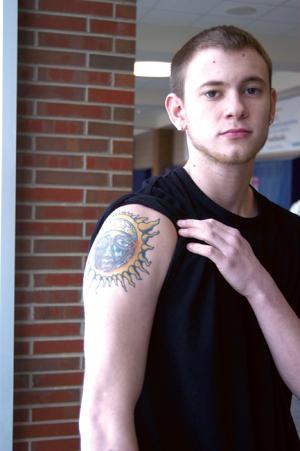 TAT IT UP: Senior Jacob “Jake” Landis shows off his Sublime-inspired tattoo. Landis, who received his tattoo just after turning 17, said although he was able to get a tattoo with parental permission, it is not always easy for underage teens to get them. ARJUNA CAPULONG / PHOTO