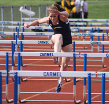 FINAL PUSH: Freshman Ashley Mealey competes in a hurdle race against Warren Central. The Hounds will have to hurdle multiple obstacles on their way to a State championship this season, and their postseason meets will begin on Saturday with the Metropolitan Interscholastic Conference meet. NICK JOHNSON / PHOTO