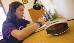 KEEPING TIME: Junior Jessie Garner reviews notes after school. According to her, while the restrictions her parents place on her limit some of her freedom, they do help her keep on top of her responsibilities. 