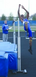 HIGH FLYER: Junior Oscar Falodun attempts a high jump during a track meet this season. NICK JOHNSON / PHOTO